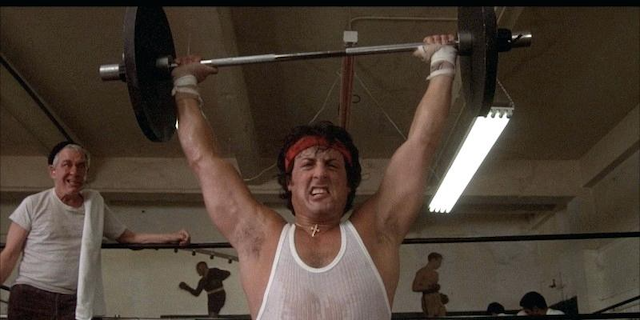 Rocky Balboa lifting a barbell